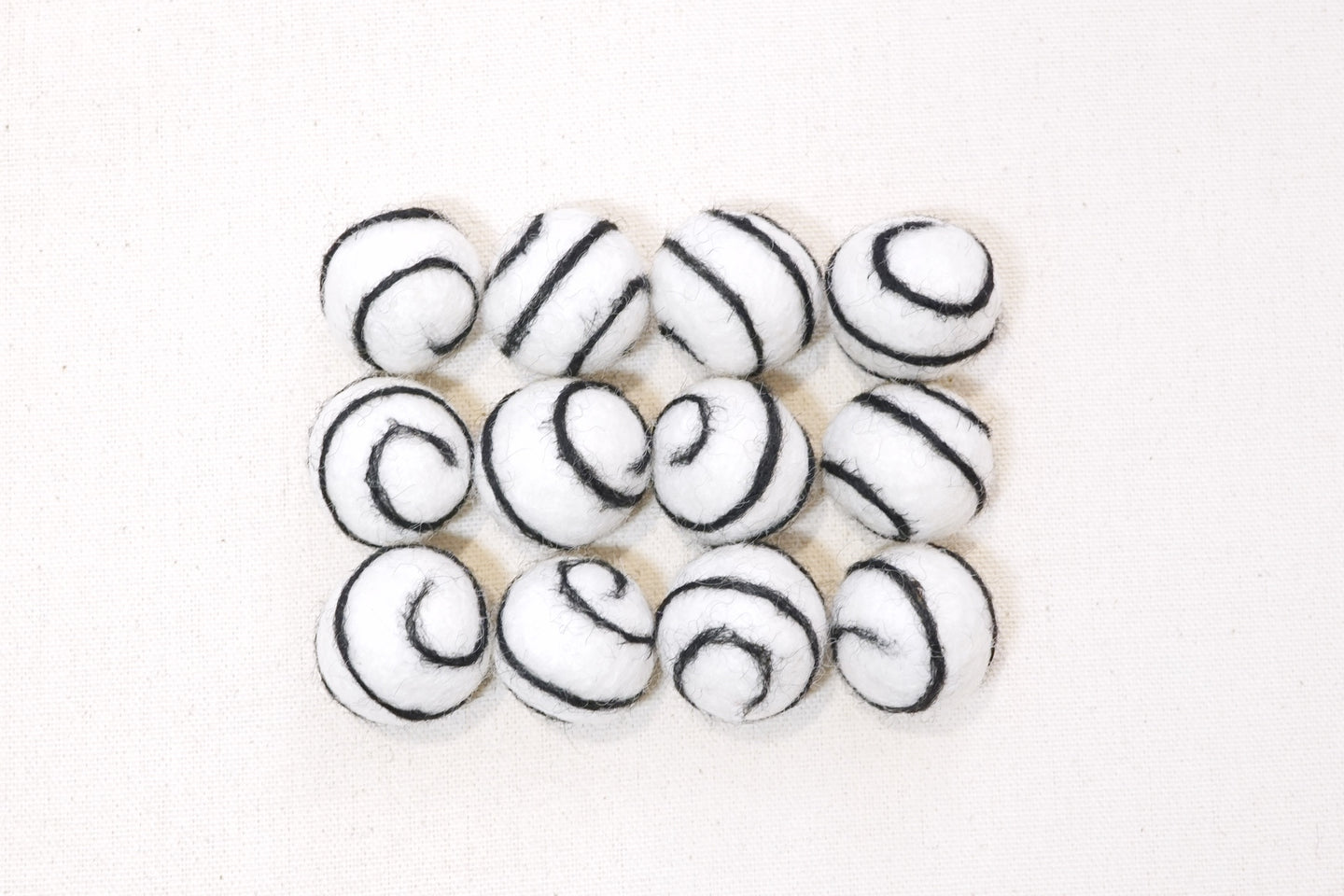 Swirl Felt Balls 25mm - White with black swirl