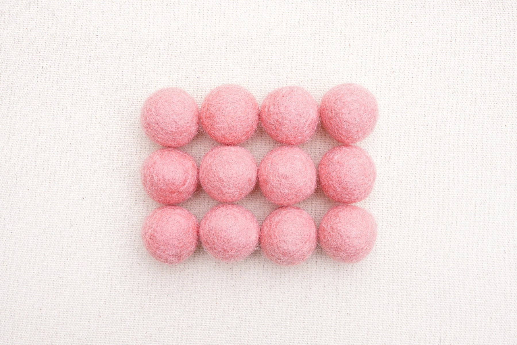 dusty pink felt balls