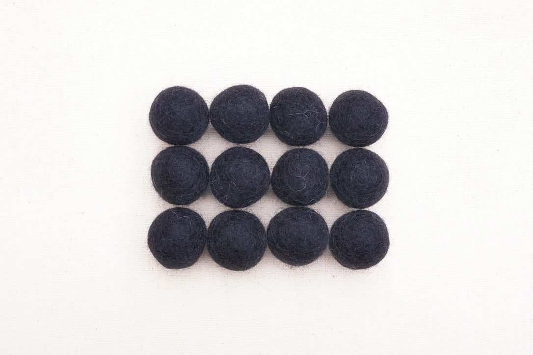 black felt balls