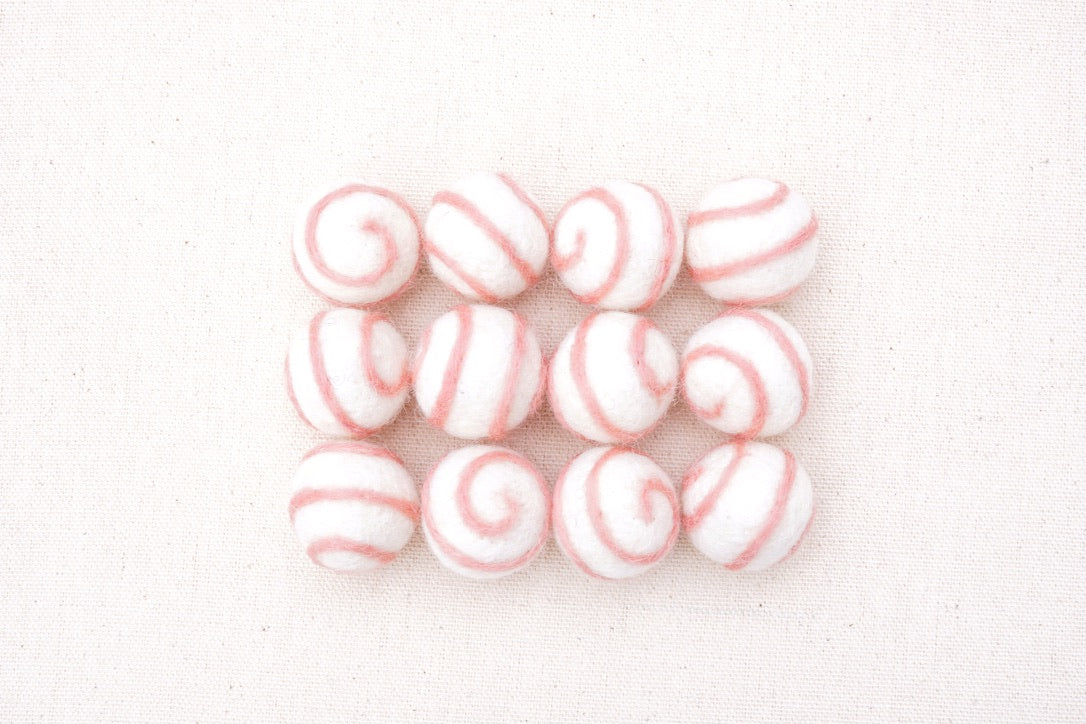 swirl felt balls white with pink swirl