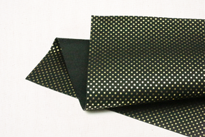 metallic gold dots on black felt