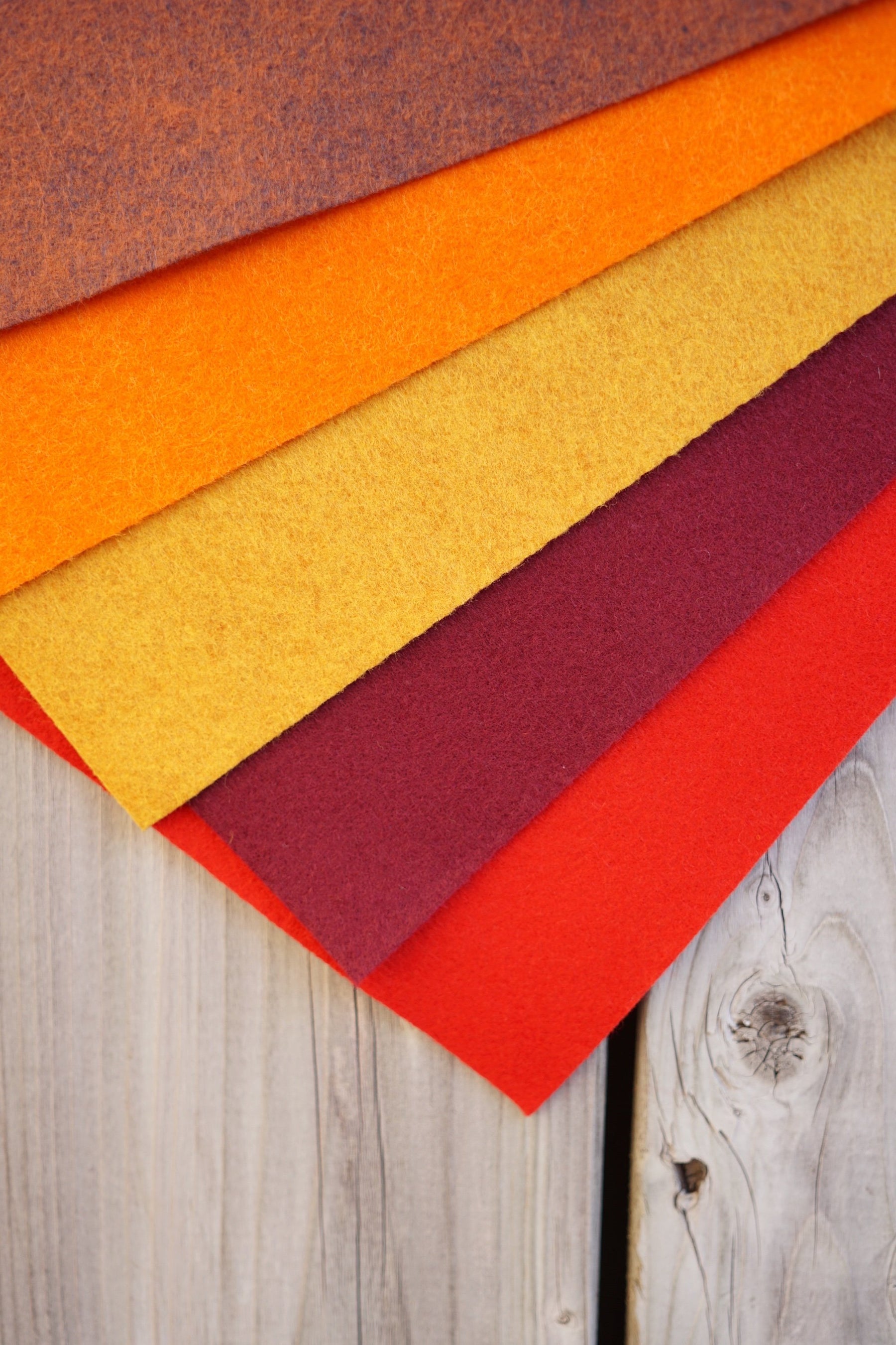 wool blend felt colours bark, sunburst, mustard, burgundy, bright red